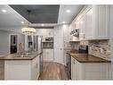 74 Canals Circle Sw, Airdrie, AB  - Indoor Photo Showing Kitchen With Double Sink With Upgraded Kitchen 