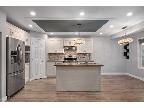 74 Canals Circle Sw, Airdrie, AB - Indoor Photo Showing Kitchen With Double Sink