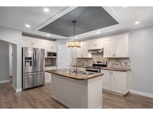 74 Canals Circle Sw, Airdrie, AB - Indoor Photo Showing Kitchen With Double Sink With Upgraded Kitchen