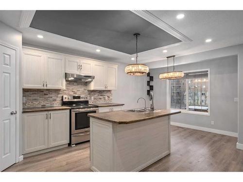 74 Canals Circle Sw, Airdrie, AB - Indoor Photo Showing Kitchen With Upgraded Kitchen