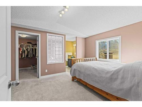 56 Grotto Way Ne, Canmore, AB - Indoor Photo Showing Bedroom