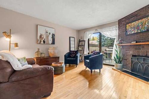 29-2210 Oakmoor Drive Sw, Calgary, AB - Indoor Photo Showing Living Room With Fireplace