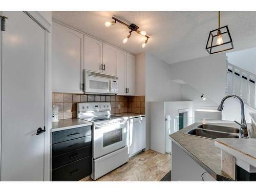 45 Prestwick Avenue Se, Calgary, AB - Indoor Photo Showing Kitchen With Double Sink