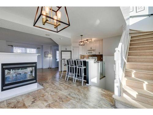 45 Prestwick Avenue Se, Calgary, AB - Indoor Photo Showing Living Room With Fireplace