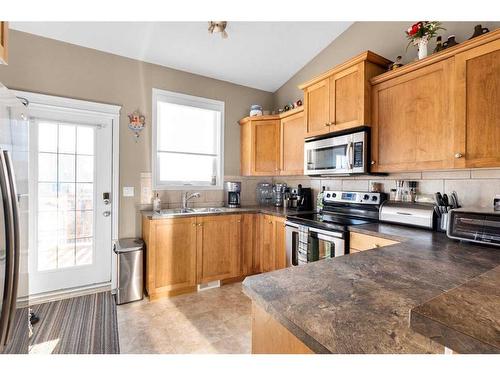 209 Valarosa Place, Didsbury, AB - Indoor Photo Showing Kitchen With Double Sink