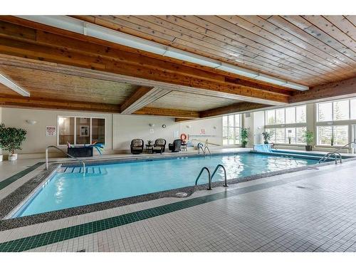 245-6868 Sierra Morena Boulevard Sw, Calgary, AB - Indoor Photo Showing Other Room With In Ground Pool