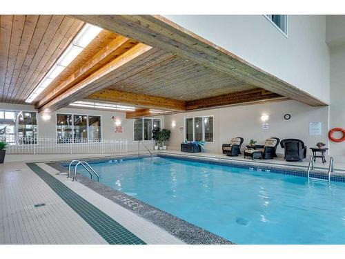 245-6868 Sierra Morena Boulevard Sw, Calgary, AB - Indoor Photo Showing Other Room With In Ground Pool