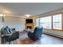 245-6868 Sierra Morena Boulevard Sw, Calgary, AB  - Indoor Photo Showing Living Room With Fireplace 