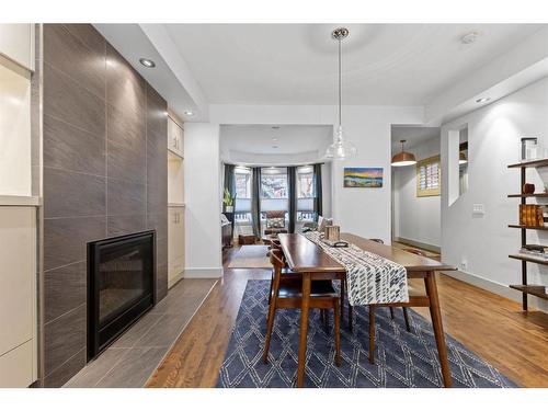 615 23 Avenue Sw, Calgary, AB - Indoor Photo Showing Dining Room With Fireplace