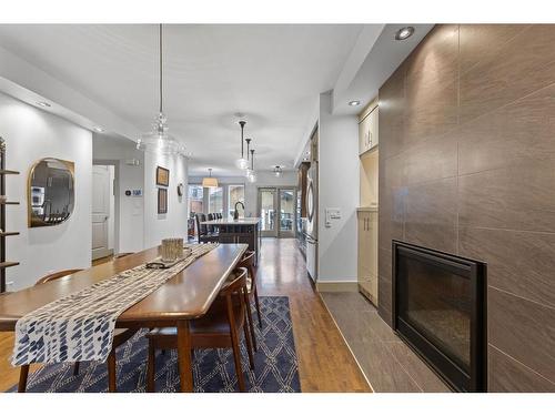 615 23 Avenue Sw, Calgary, AB - Indoor Photo Showing Dining Room With Fireplace