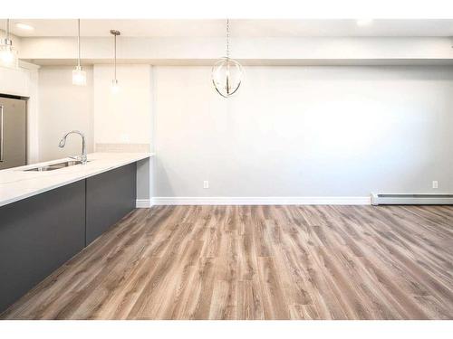 302-19661 40 Street Se, Calgary, AB - Indoor Photo Showing Kitchen