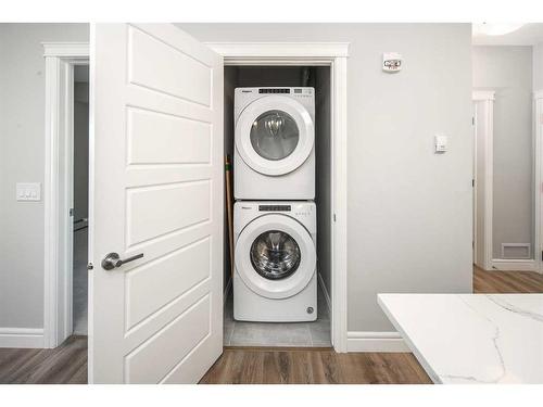 302-19661 40 Street Se, Calgary, AB - Indoor Photo Showing Laundry Room