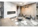 302-19661 40 Street Se, Calgary, AB  - Indoor With Fireplace 