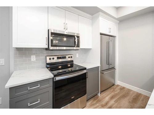 302-19661 40 Street Se, Calgary, AB - Indoor Photo Showing Kitchen With Stainless Steel Kitchen With Upgraded Kitchen