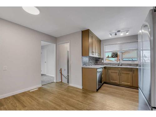 12 Penswood Place Se, Calgary, AB - Indoor Photo Showing Kitchen With Double Sink