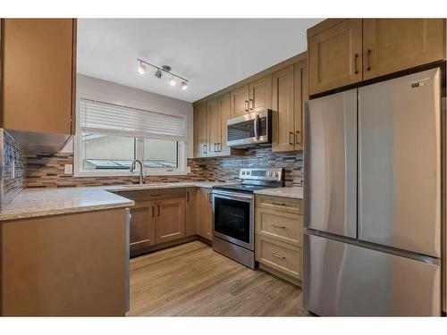 12 Penswood Place Se, Calgary, AB - Indoor Photo Showing Kitchen With Stainless Steel Kitchen