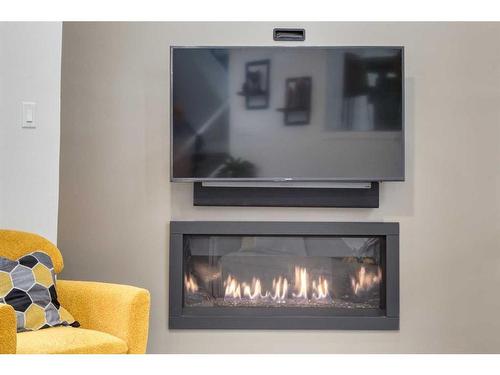 3920 Point Mckay Road Nw, Calgary, AB - Indoor Photo Showing Living Room With Fireplace