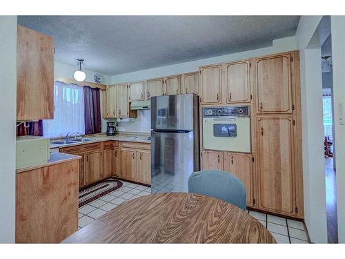 9131 Academy Drive Se, Calgary, AB - Indoor Photo Showing Kitchen With Double Sink