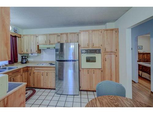 9131 Academy Drive Se, Calgary, AB - Indoor Photo Showing Kitchen With Double Sink