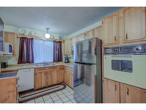 9131 Academy Drive Se, Calgary, AB - Indoor Photo Showing Kitchen With Double Sink