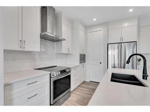 12 Rowley Terrace Nw, Calgary, AB - Indoor Photo Showing Kitchen With Double Sink With Upgraded Kitchen