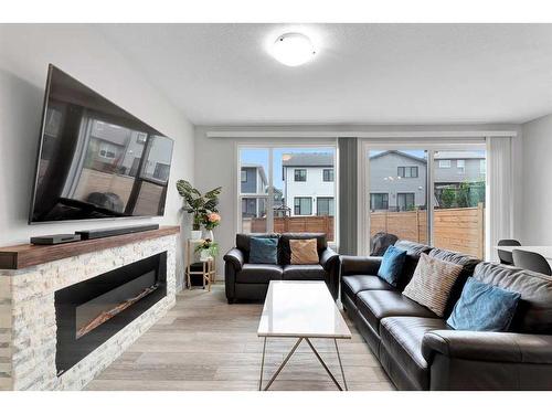 12 Rowley Terrace Nw, Calgary, AB - Indoor Photo Showing Living Room With Fireplace