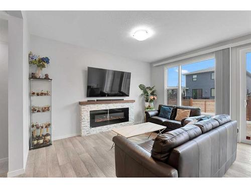 12 Rowley Terrace Nw, Calgary, AB - Indoor Photo Showing Living Room With Fireplace