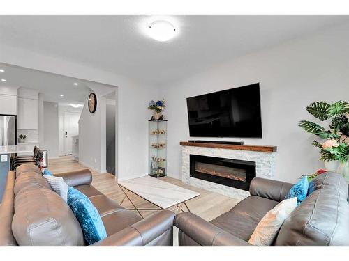 12 Rowley Terrace Nw, Calgary, AB - Indoor Photo Showing Living Room With Fireplace