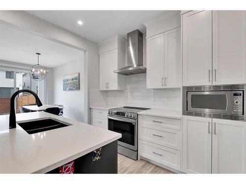 12 Rowley Terrace Nw, Calgary, AB - Indoor Photo Showing Kitchen With Double Sink With Upgraded Kitchen