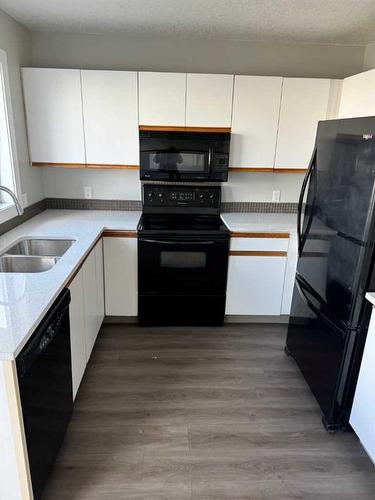 46 Martinridge Crescent Ne, Calgary, AB - Indoor Photo Showing Kitchen With Double Sink