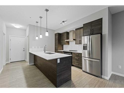 105-2231 Mahogany Boulevard Se, Calgary, AB - Indoor Photo Showing Kitchen With Stainless Steel Kitchen With Upgraded Kitchen