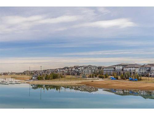 105-2231 Mahogany Boulevard Se, Calgary, AB - Outdoor With Body Of Water With View