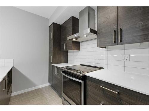 105-2231 Mahogany Boulevard Se, Calgary, AB - Indoor Photo Showing Kitchen With Upgraded Kitchen