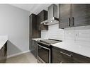 105-2231 Mahogany Boulevard Se, Calgary, AB  - Indoor Photo Showing Kitchen With Upgraded Kitchen 