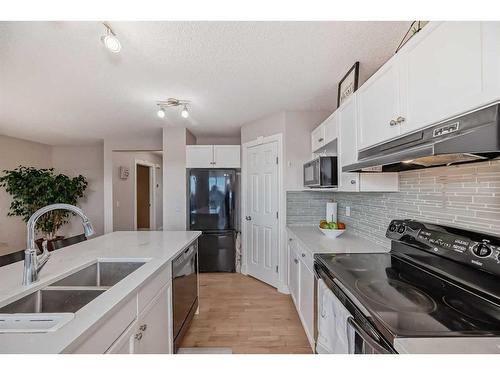 91 Arbour Meadows Close Nw, Calgary, AB - Indoor Photo Showing Kitchen With Double Sink