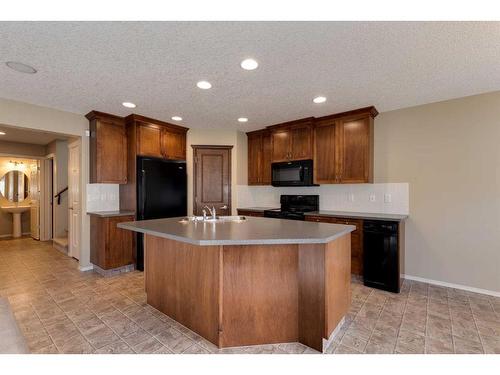 41 Eversyde Close Sw, Calgary, AB - Indoor Photo Showing Kitchen With Double Sink