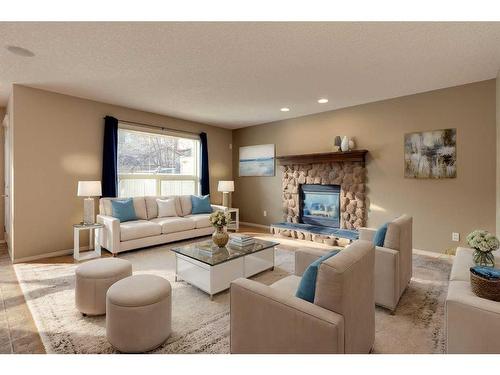 41 Eversyde Close Sw, Calgary, AB - Indoor Photo Showing Living Room With Fireplace