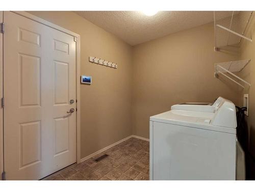 41 Eversyde Close Sw, Calgary, AB - Indoor Photo Showing Laundry Room