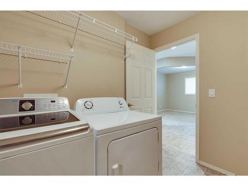 41 Eversyde Close Sw, Calgary, AB - Indoor Photo Showing Laundry Room