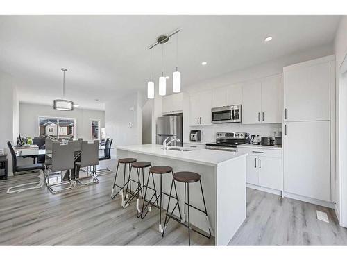 538 Canals Crossing Sw, Airdrie, AB - Indoor Photo Showing Kitchen With Stainless Steel Kitchen With Double Sink With Upgraded Kitchen