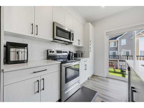 538 Canals Crossing Sw, Airdrie, AB - Indoor Photo Showing Kitchen With Stainless Steel Kitchen With Upgraded Kitchen