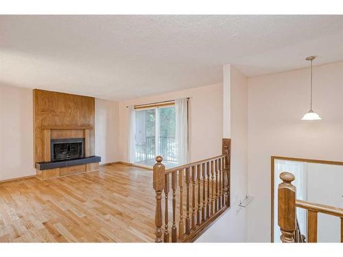 5-1608 16 Avenue Sw, Calgary, AB - Indoor Photo Showing Living Room With Fireplace