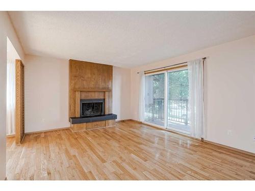 5-1608 16 Avenue Sw, Calgary, AB - Indoor Photo Showing Living Room With Fireplace