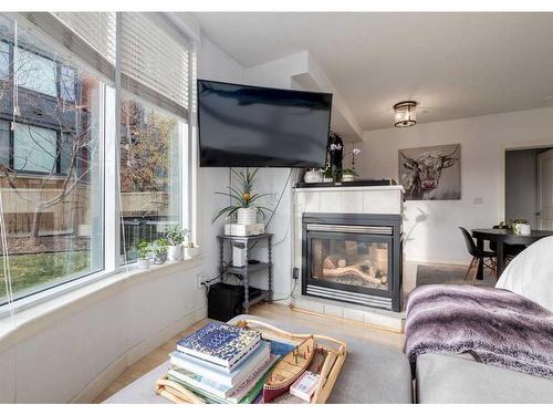 323-1800 14A Street Sw, Calgary, AB - Indoor Photo Showing Living Room With Fireplace