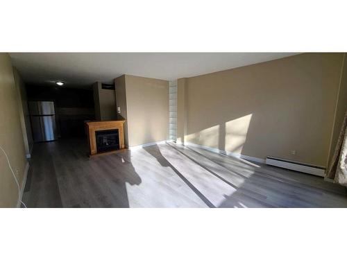 302-1524 15 Avenue Sw, Calgary, AB - Indoor With Fireplace