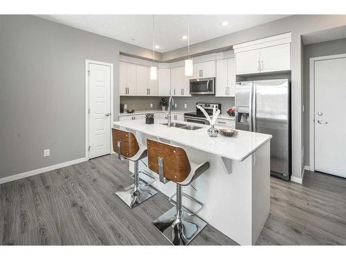 302-6603 New Brighton Avenue Se, Calgary, AB - Indoor Photo Showing Kitchen With Double Sink