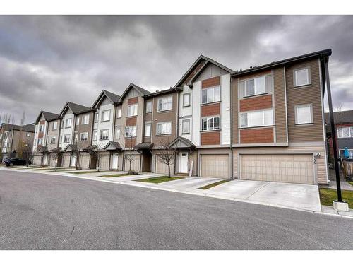 140 Copperpond Villas Se, Calgary, AB - Outdoor With Facade