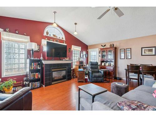 23-12 Woodside Rise Nw, Airdrie, AB - Indoor Photo Showing Living Room With Fireplace