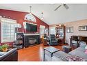 23-12 Woodside Rise Nw, Airdrie, AB  - Indoor Photo Showing Living Room With Fireplace 