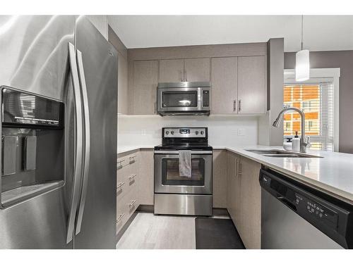 3301-302 Skyview Ranch Drive Ne, Calgary, AB - Indoor Photo Showing Kitchen With Stainless Steel Kitchen With Double Sink With Upgraded Kitchen